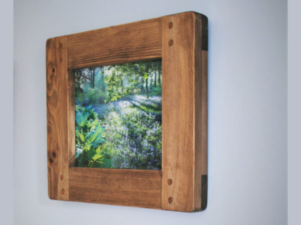 Picture photo frame for A4 size image handmade in Somerset UK in chunky rustic sustainable natural wood, landscape side view.