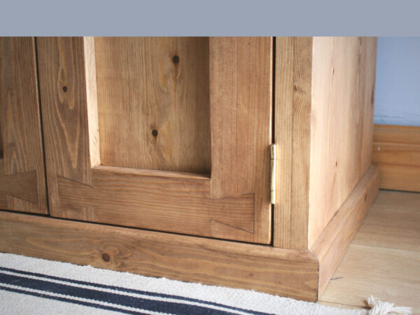 Wooden cabinets with plinth detail and dovetail doors