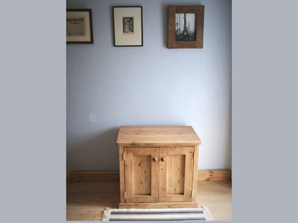 Wooden sideboard cabinet and chunky rustic tv stand seen from above front.
