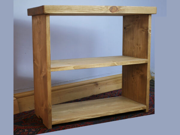 Small rustic bookcase in natural sustainable wood, empty view.