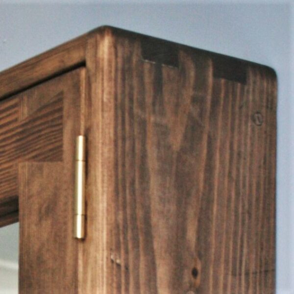 close up of finger joints on large wooden bathroom cabinet in dark Danish Oil