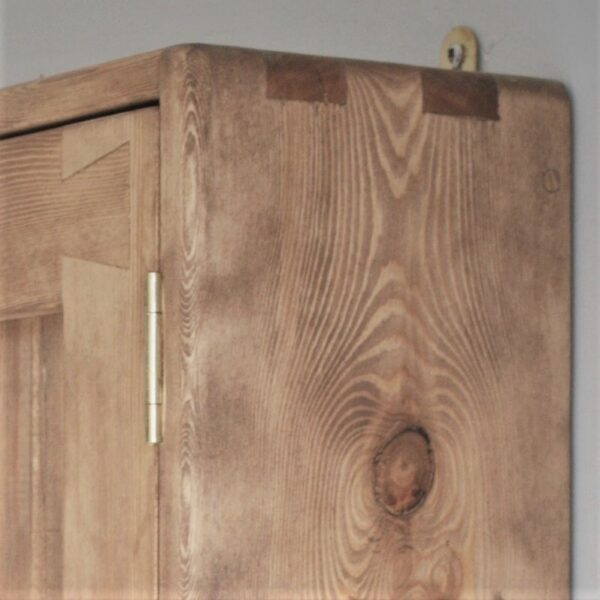 close up of finger joints on our wooden kitchen cabinet in rustic cottage style.