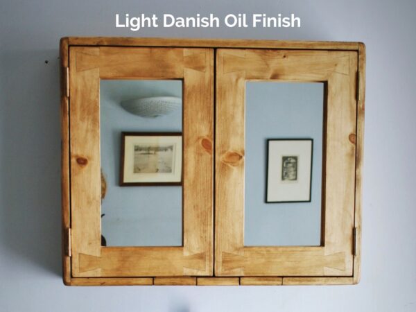 Mirrored bathroom cabinet 65 x 60 x14 in a light Danish Oil