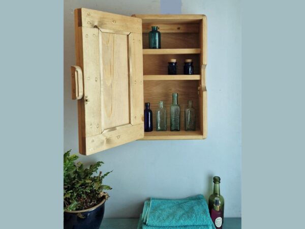 Slim wooden bathroom cabinet and towel storage cupboard for narrow space in rustic natural wood UK.