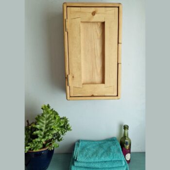 Slim wooden bathroom cabinet and towel storage cupboard for narrow space in rustic natural wood UK.
