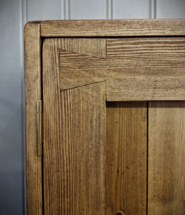 Kitchen cabinet in dark wood with double dovetail doors, Marc Wood Furniture in Somerset UK