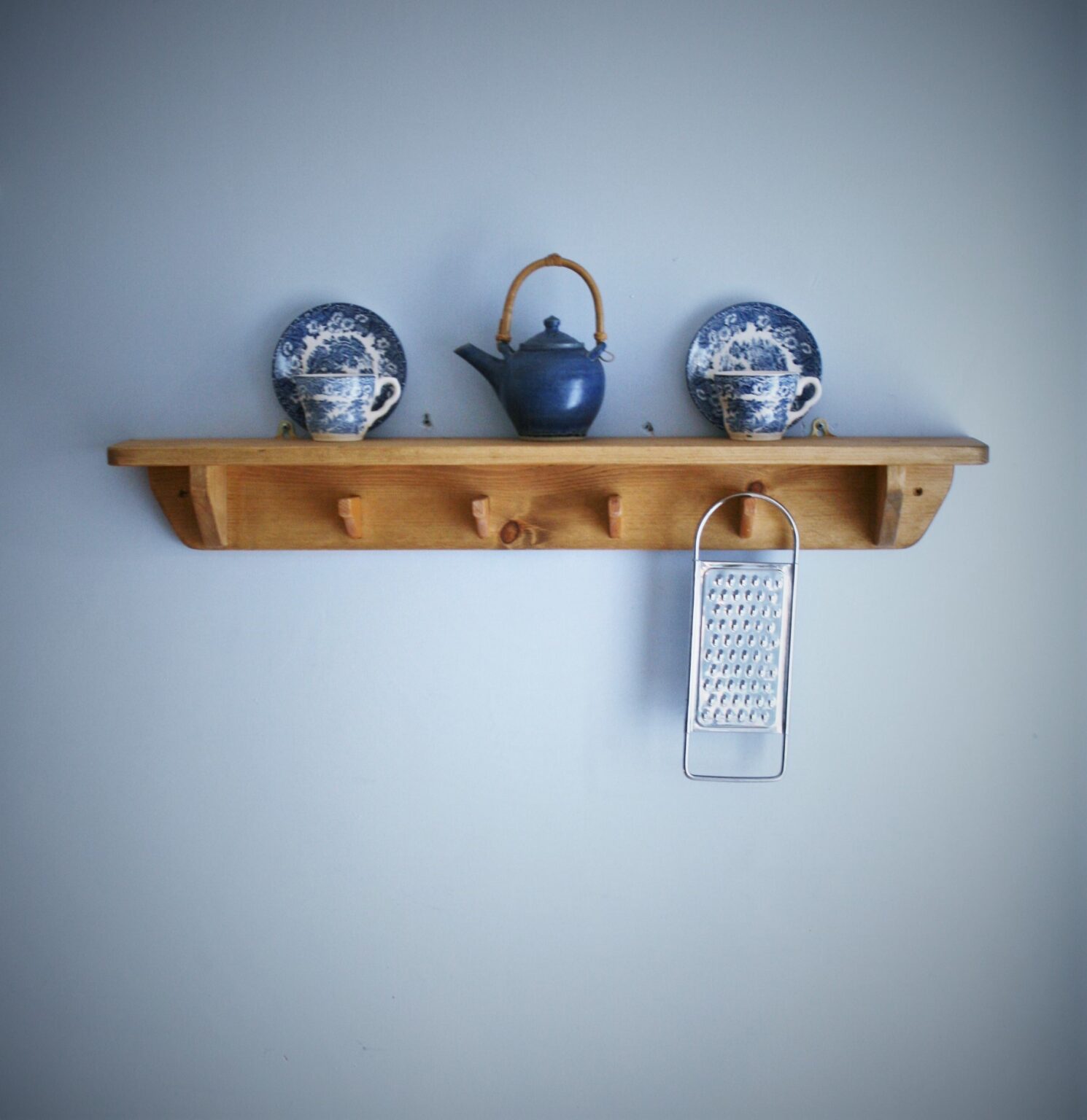 Kitchen shelf with hooks