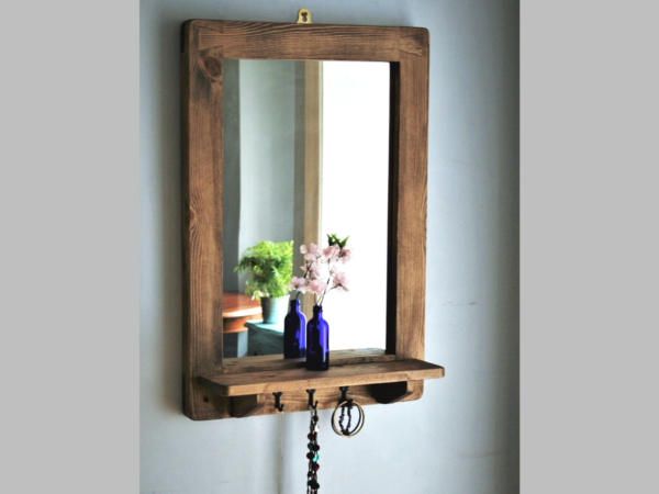 Wooden mirror with shelf and hooks handmade in Somerset UK with 3 vintage rustic jewellery hanger hooks for bedroom styling.