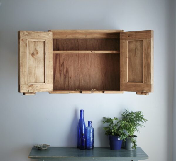 Bathroom cabinet without mirror, with 2 chunky rustic wooden doors open, handmade in Somerset UK; front view.
