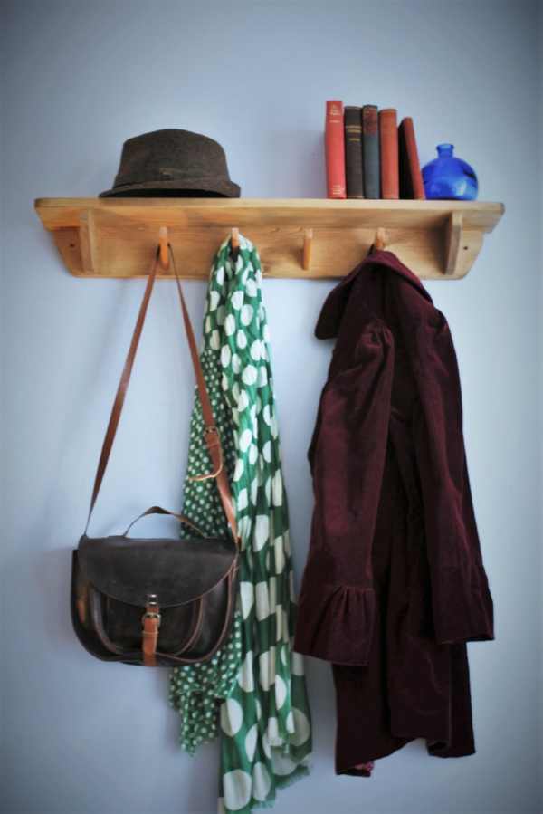 Hallway shelf with hooks and rustic wooden coat rack. Low view. Designed and handmade in Somerset UK