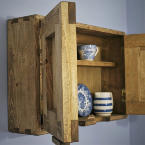 Small wooden kitchen cabinet with open door. Handmade in natural rustic wood in Somerset UK