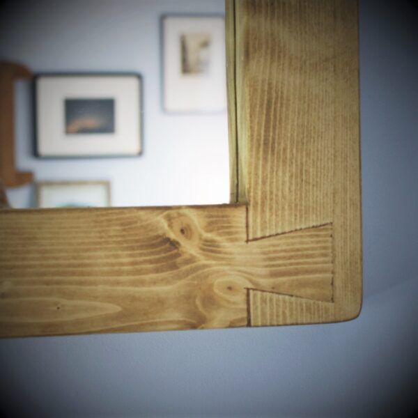 Wooden wall mirror, lower dovetail joint detail.