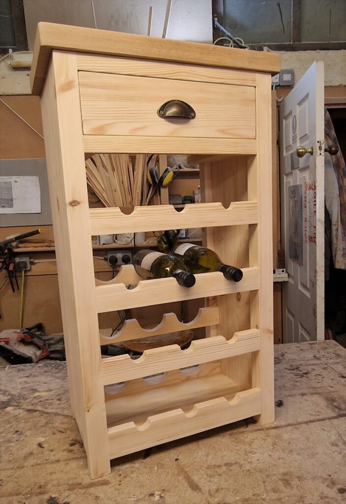 Tall wine rack in natural wood with a wooden Oak and Ash worktop. Handmade in Somerset UK.