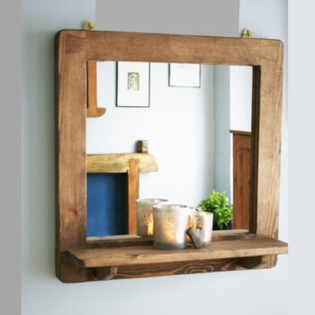 Mirror with shelf, minimalist rustic dark wooden bathroom and hallway, close up. Handmade in Somerset UK