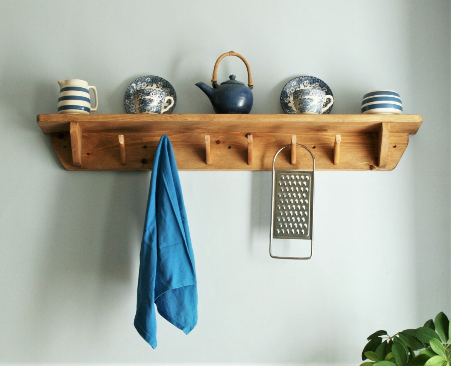 Kitchen shelf with hooks