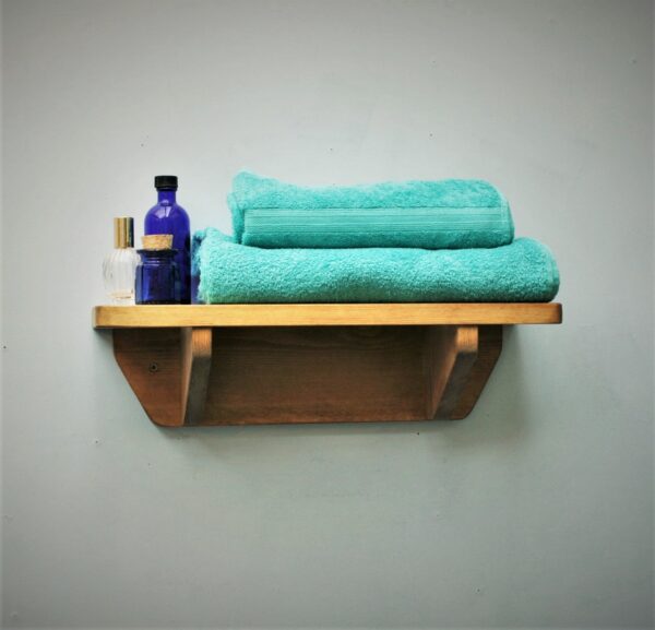 Small wooden bathroom shelf in chunky natural wood. For cosmetics, plants and towels, handmade in Somerset UK