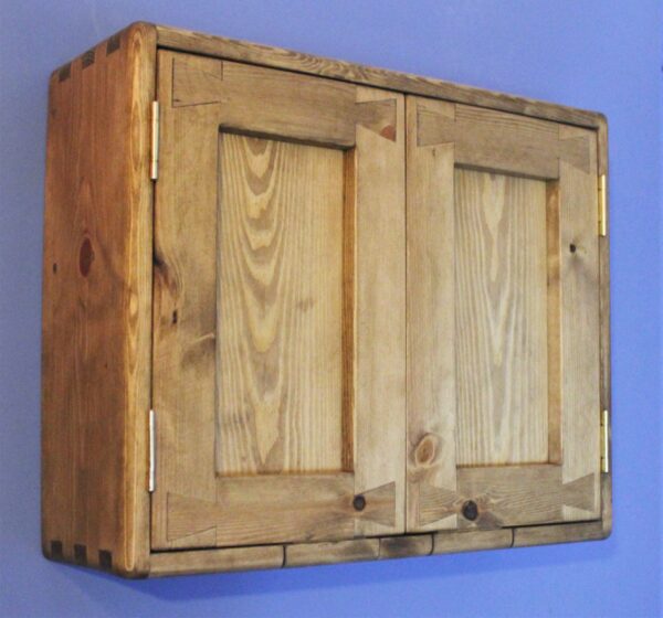 Small wooden kitchen cabinet with double doors, side view. Handmade in natural rustic wood in Somerset UK