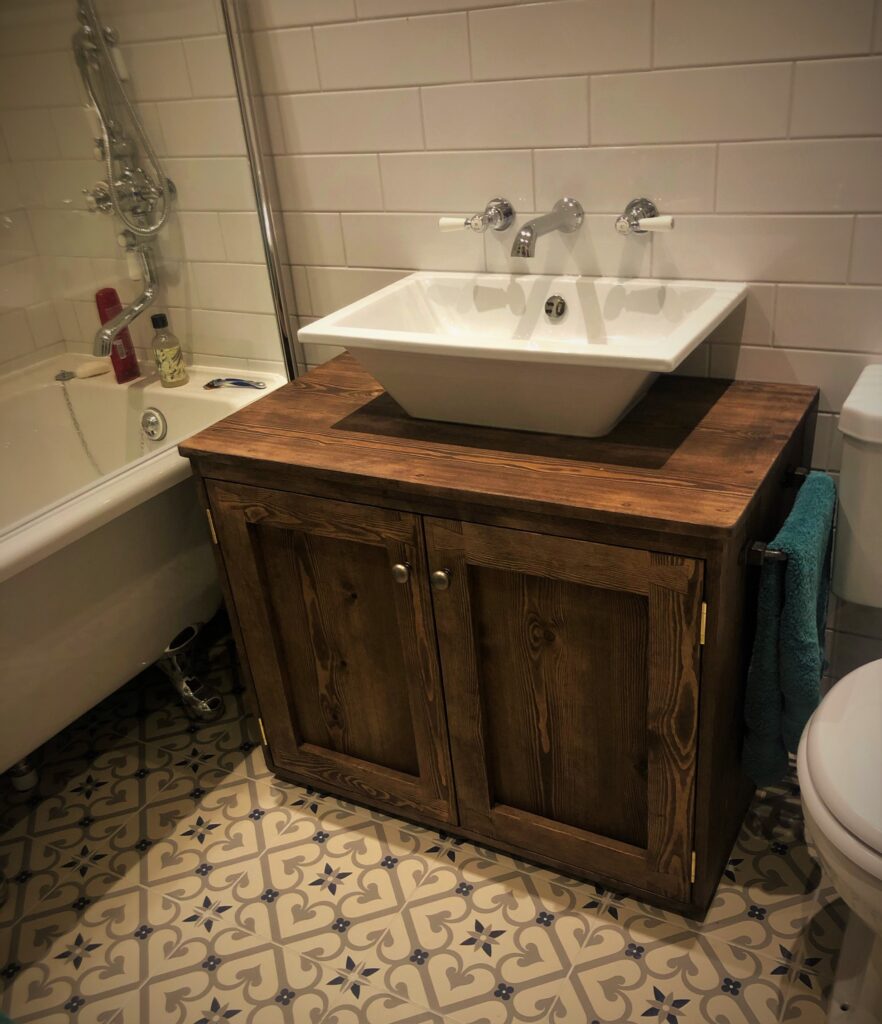 Sink vanity wash stand with chunky doors in natural rustic dark wood. Handmade in Somerset UK.