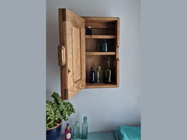 Slim dark wood bathroom cabinet without a mirror and shown with the chunky door open. Handmade in Somerset UK.