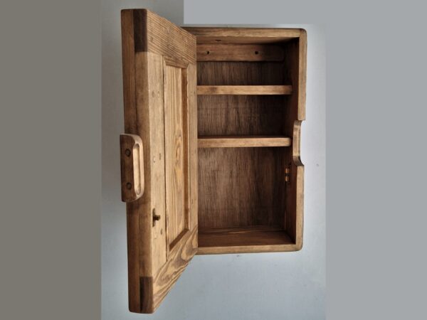Slim dark wood kitchen cabinet, shown with the door open. Handmade in Somerset UK.