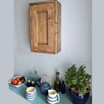 Slim dark kitchen cabinet in minimalist rustic style. Side view. Handmade from natural wood in Somerset UK.