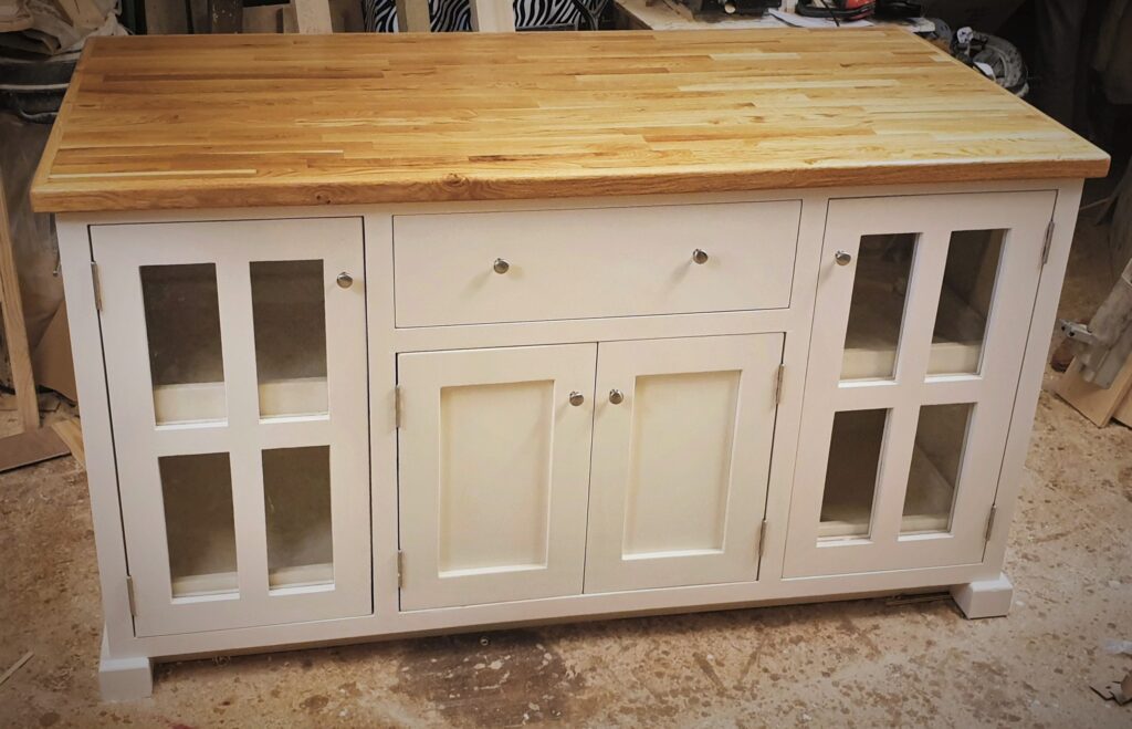 Large kitchen island with a wide wooden Oak and Ash worktop and painted white. Handmade in Somerset UK.