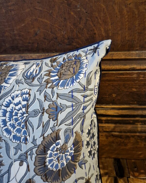 Blue Kantha cushion cover with arts and crafts boho floral print, close up.