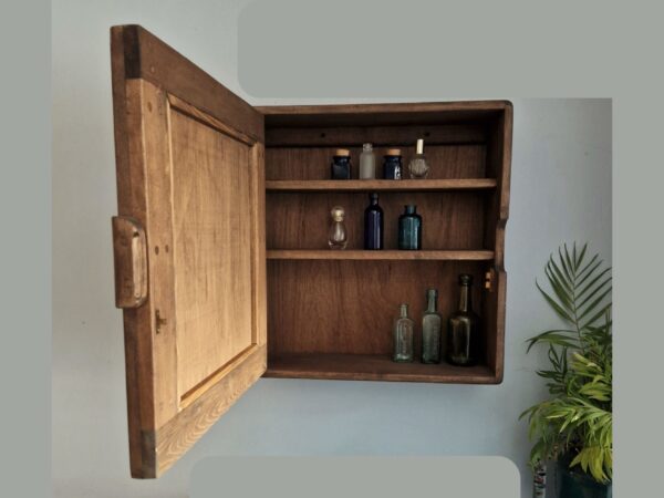 Dark wood bathroom cabinet, modern rustic wooden mirror cabinet, interior view.