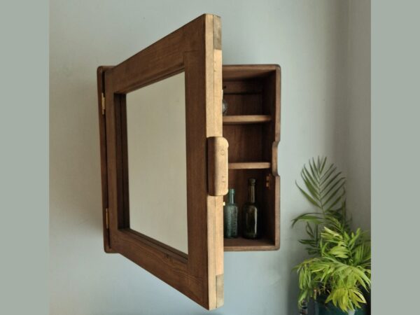 Dark wood bathroom cabinet, modern rustic wooden mirror cabinet, seen with the door open.