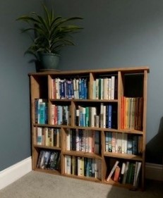 Non uniform bookcase and room divider in chunky natural wood, handmade in Somerset UK.