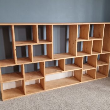 Large irregular bookcase in chunky natural wood, deep shelves, uneven modern rustic bookcase and room divider custom handmade in Somerset UK
