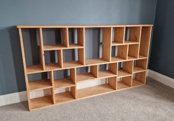 Large irregular bookcase in chunky natural wood, deep shelves, uneven modern rustic bookcase and room divider custom handmade in Somerset UK
