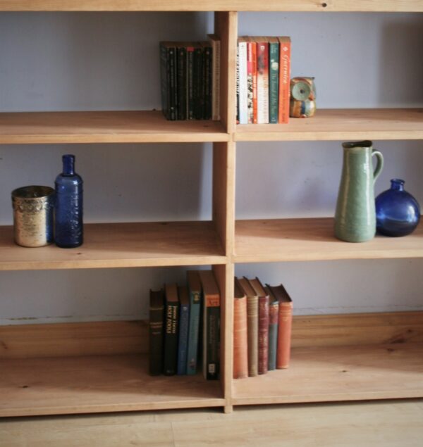 Large irregular wooden bookcase in chunky rustic natural wood, handmade in Somerset UK. Middle view.