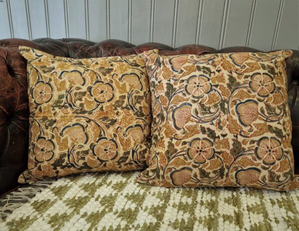 Arts and crafts cushion cover in warm terracotta orange and green floral pattern. Bohemian rustic home from Somerset UK