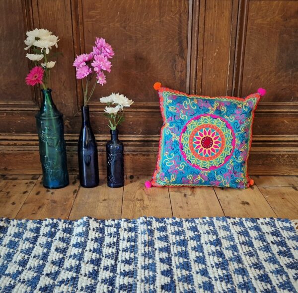 Colourful applique cushion cover, graphic multicoloured pattern in bright tones. Bohemian rustic home accessories from Somerset UK.
