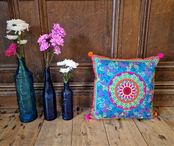 Colourful applique cushion cover, bright multicoloured pattern in bright tones. Bohemian rustic home accessories from Somerset UK