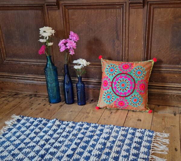 Embroidered bohemian cushion cover, pattern in pretty jewel tones - ethical bohemian rustic homeware from Marc Wood in Somerset.