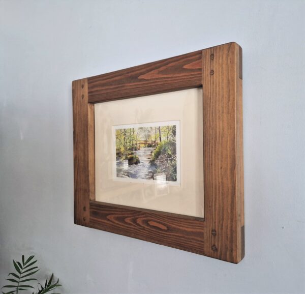 Chunky wooden rustic frame 11 x 14 inch handmade in Somerset UK in chunky rustic, sustainable natural wood. Close side view.