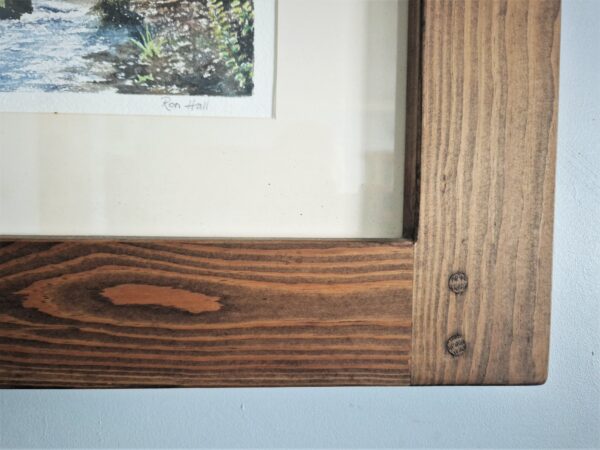Detail of chunky wooden picture frame.