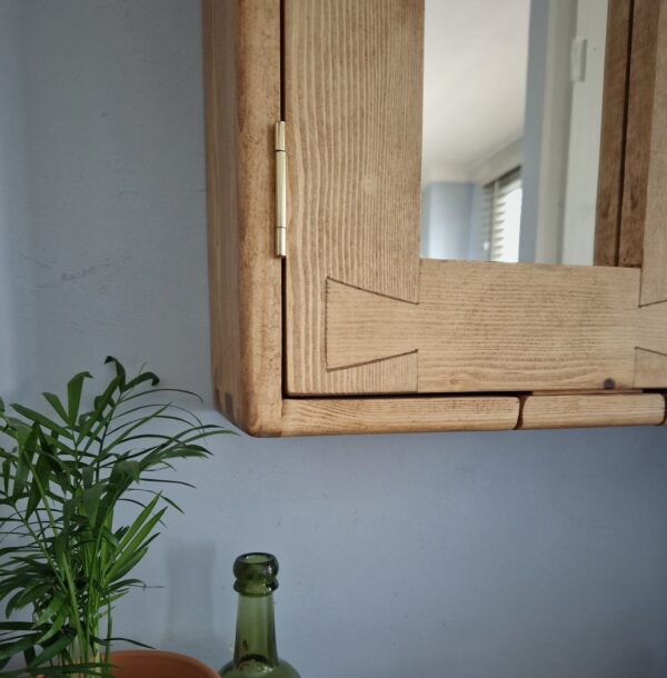 Wooden medicine cabinet, close up of Dovetail door by Marc Wood Furniture UK