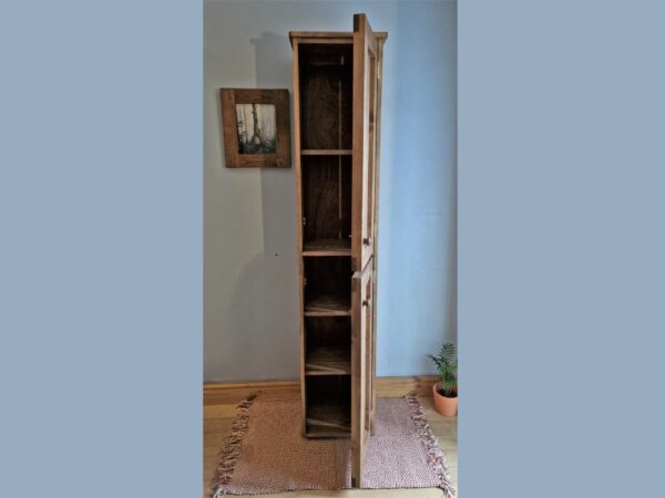 Narrow farmhouse larder cupboard and rustic slim freestanding kitchen pantry cabinet from Somerset UK, with double doors open.