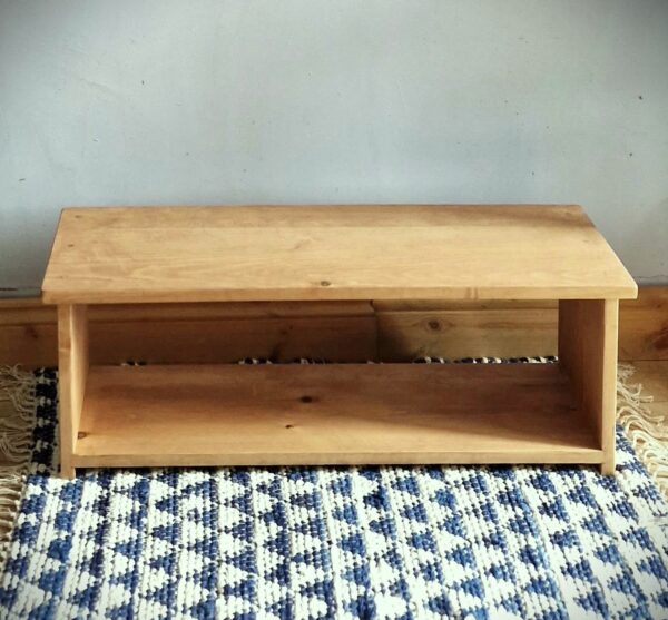 Low wooden shoe rack, modern rustic single tier shoe shelf in natural, sustainable wood from Somerset UK, top view.