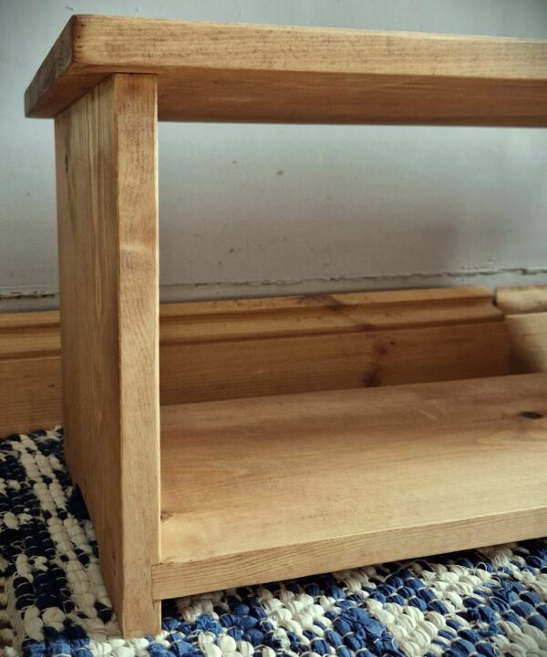 Low wooden shoe rack, modern rustic single tier shoe shelf, traditional furniture making from Somerset UK, side view.