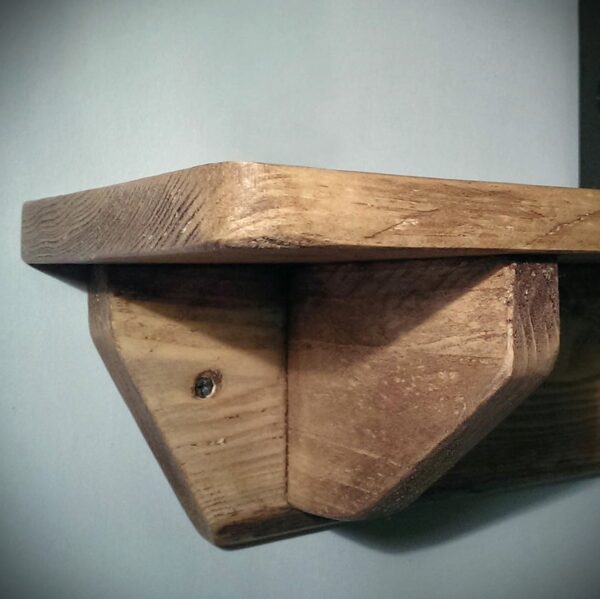 Small rustic wooden shelf with integrated wood brackets