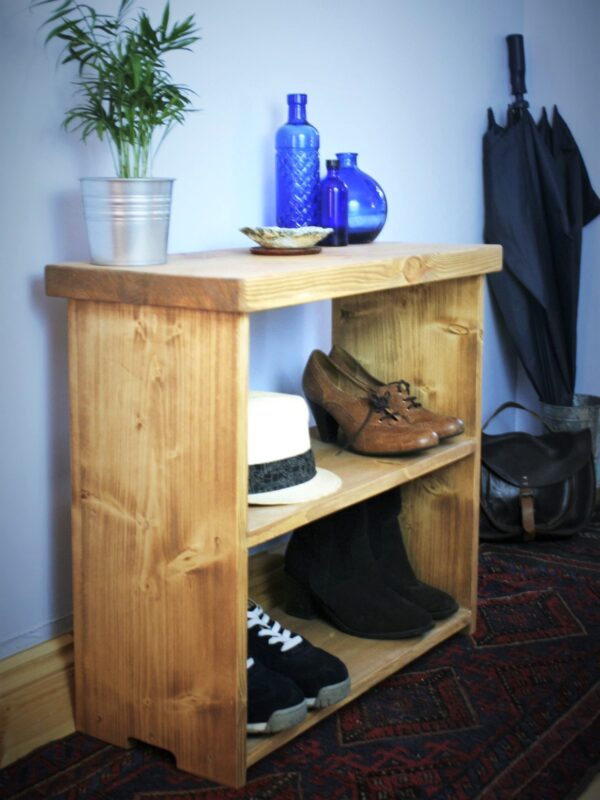 Rustic wooden shoe bench, boot room or hallway shoe storage rack in natural, sustainable wood from Somerset UK, side view.