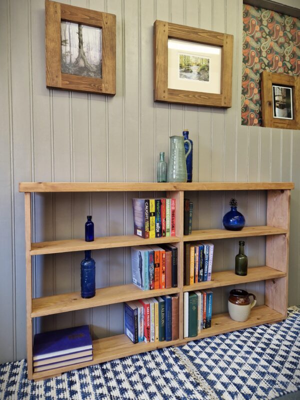 Rustic double bookcase and compartment shelving unit, wide, slim wooden bookshelves handmade in Somerset UK, side view