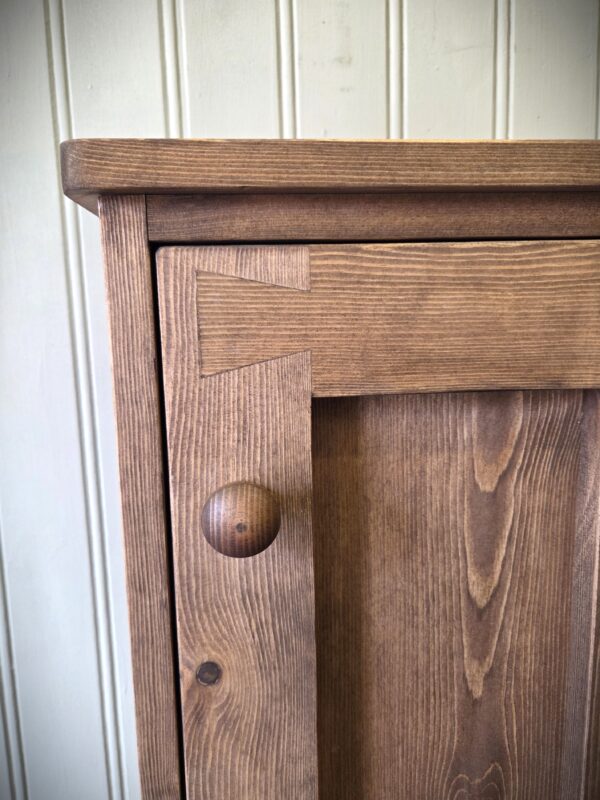Slim wooden bathroom cupboard with a single door from Somerset UK
